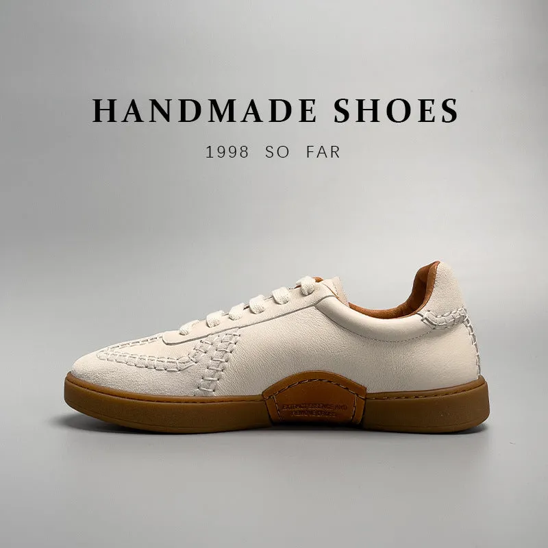 Men's beige genuine leather low-cut sneakers with white lace-up front and rubber sole on neutral background