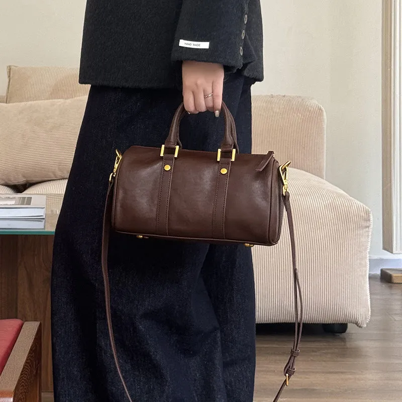 Retro portable cowhide crossbody bag in pillow shape with sewing thread detail, black colour