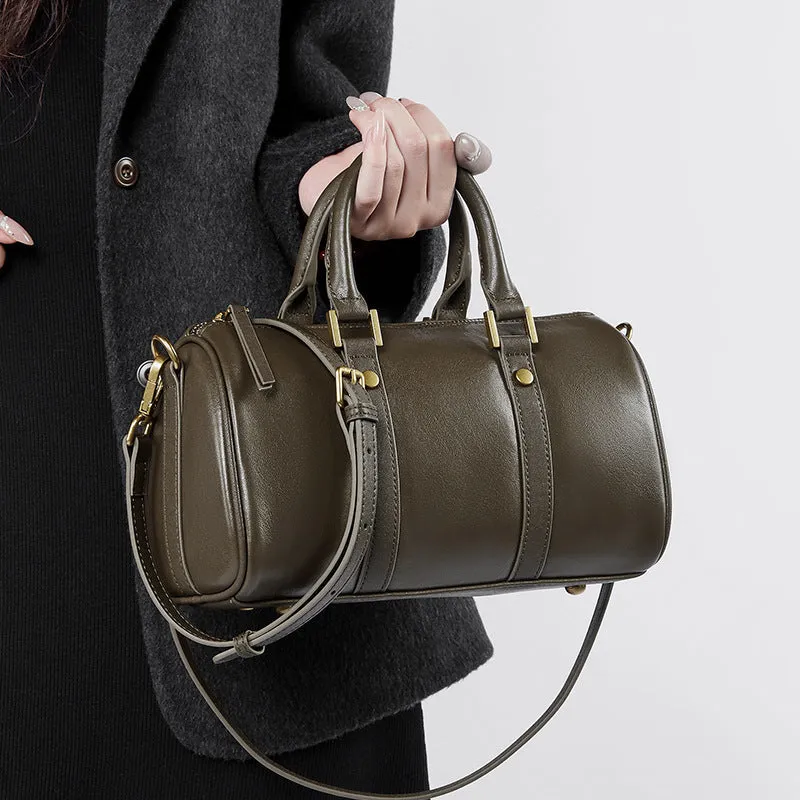 Retro portable cowhide crossbody bag in pillow shape with sewing thread detail, black colour