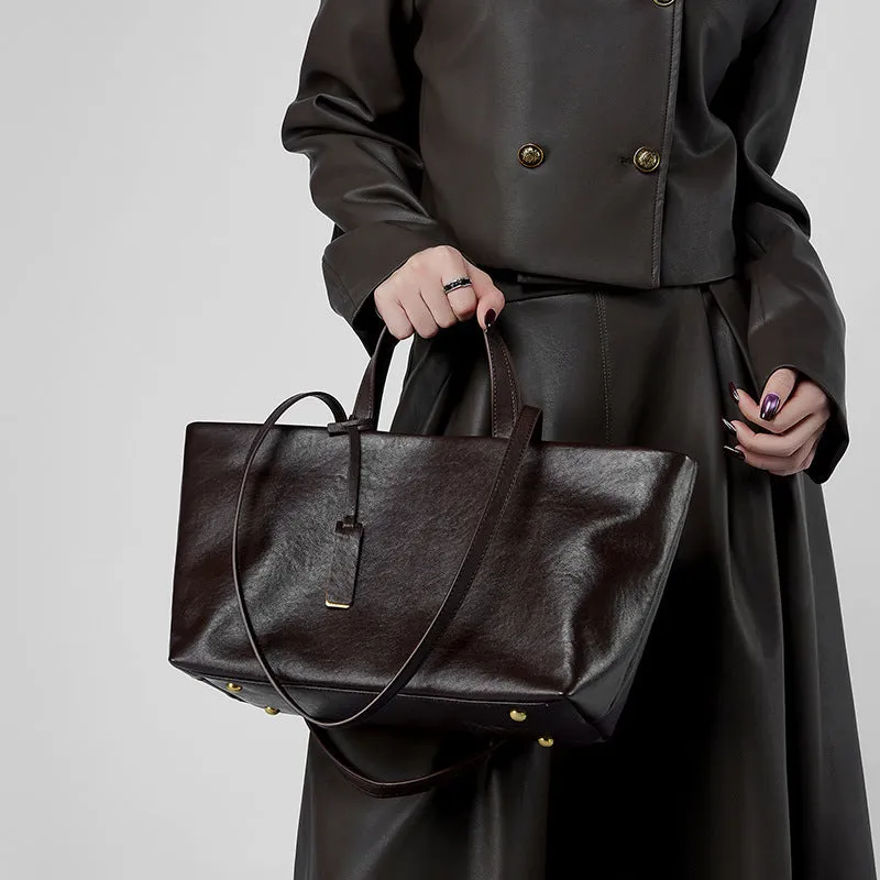 Genuine leather women's underarm shoulder bag in brown, 32x13x22cm, with sewing line detail