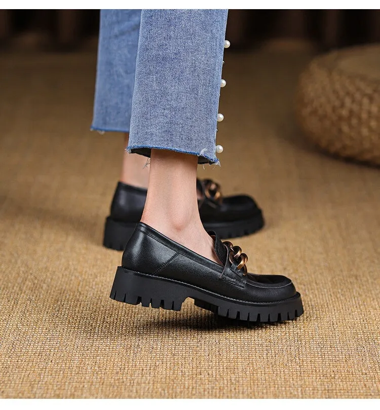 Retro platform loafers in brown cowhide patterned leather with a round toe and rubber sole