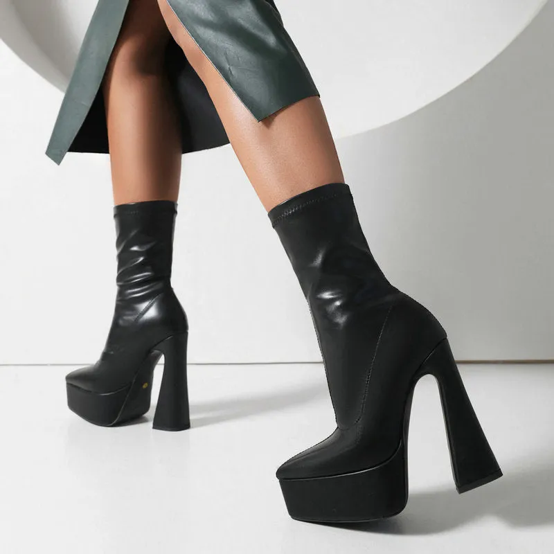 Women's black platform booties with thick super high heel and short stout heel