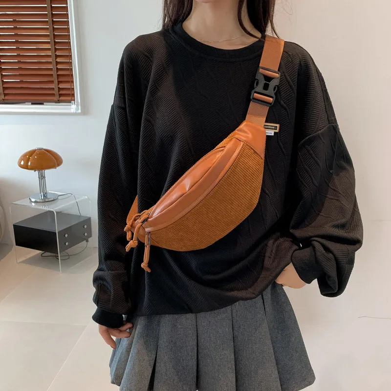 Corduroy crossbody bag in brown with oval shape, slit pocket, and crossbody strap
