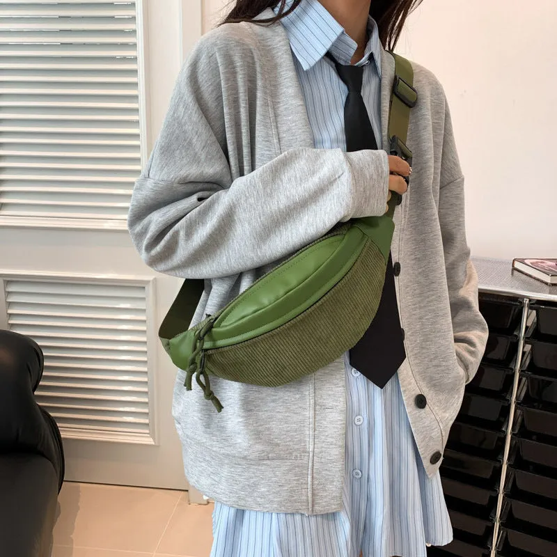 Corduroy crossbody bag in brown with oval shape, slit pocket, and crossbody strap