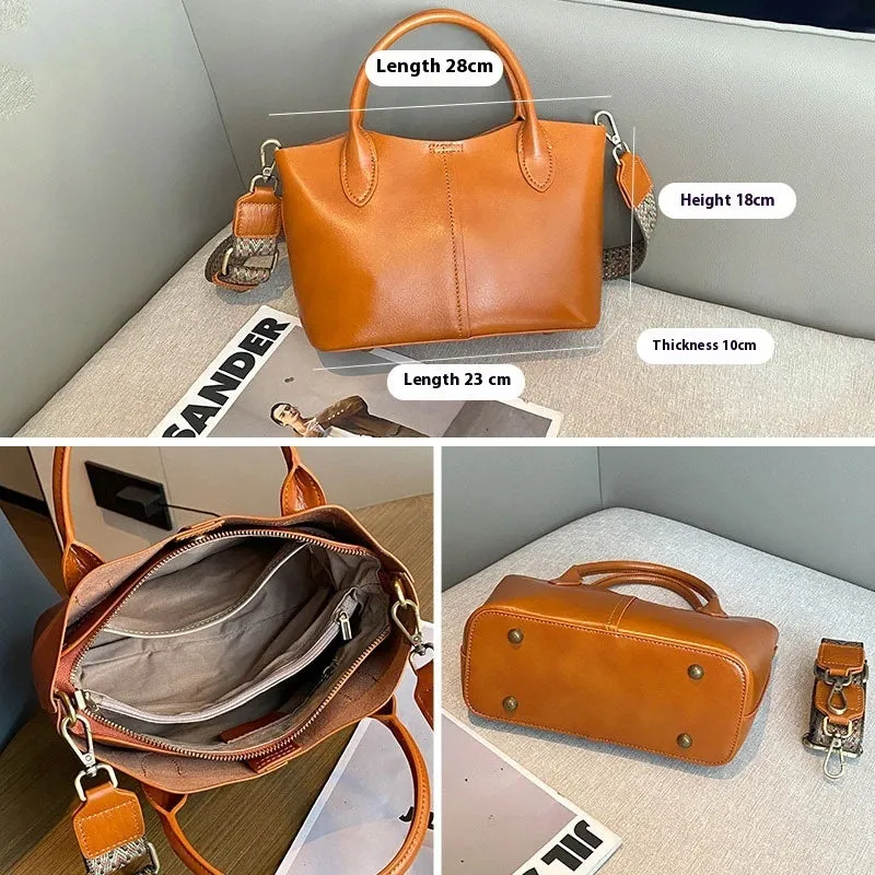 Shell-shaped women's crossbody handbag in genuine cowhide leather with sewing thread details, available in beige colour