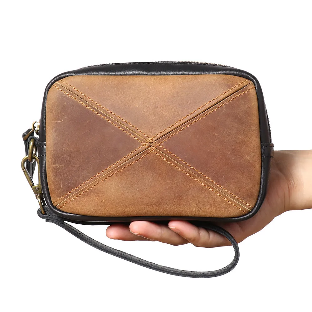 Unisex retro brown genuine leather messenger bag with artistic stitching and horizontal square shape on a plain background
