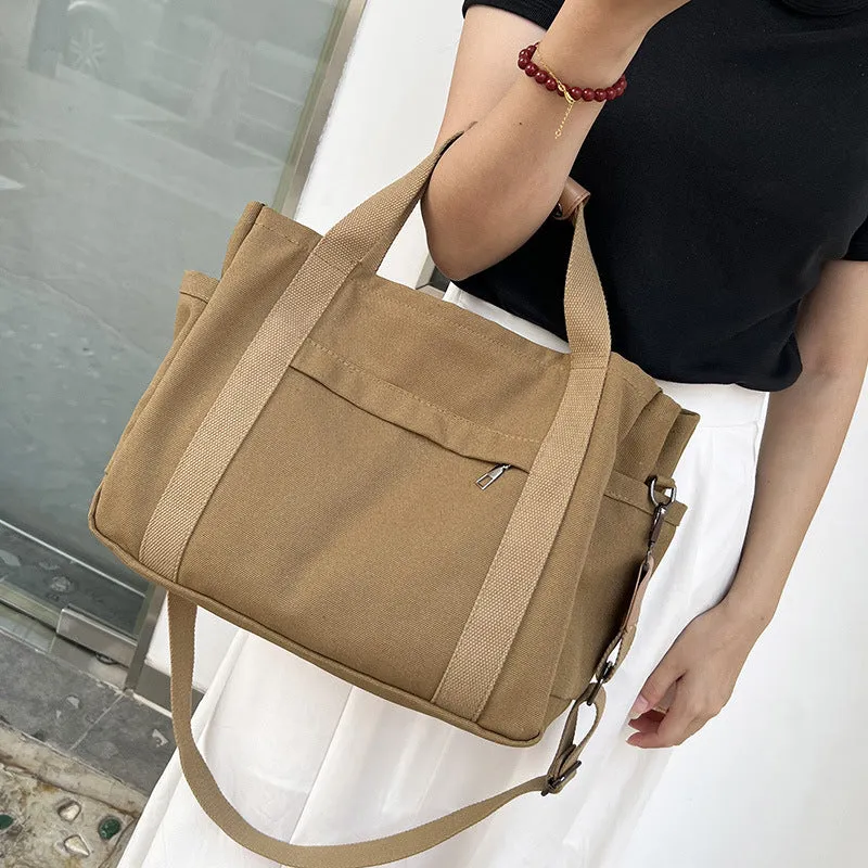 Canvas tote bag with multiple internal pockets including computer pocket, shown in horizontal square shape
