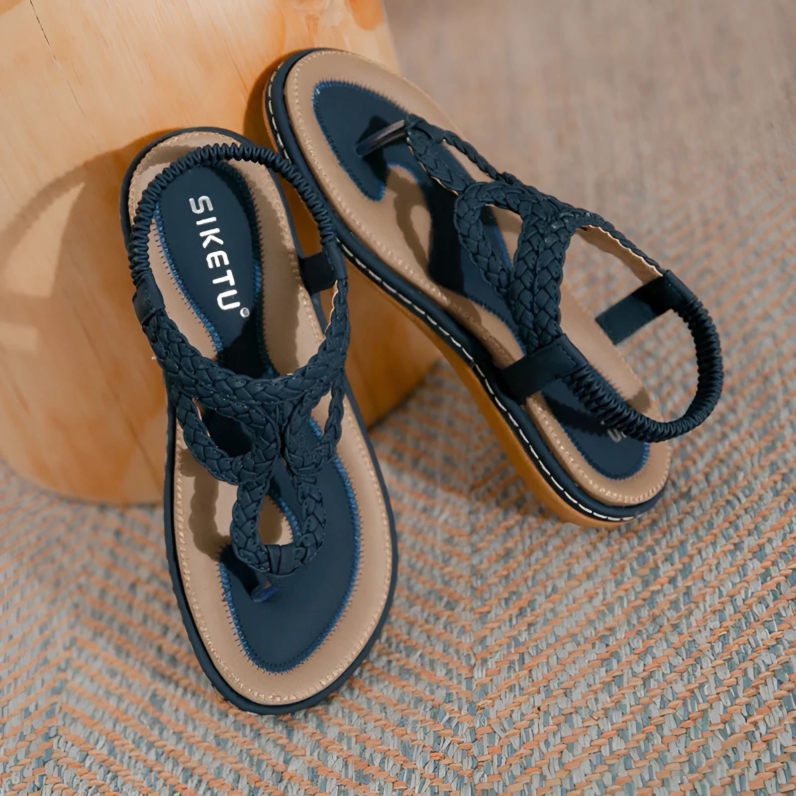 Women's woven flat sandals in solid colour low top with rubber sole, available in black apricot or sapphire blue