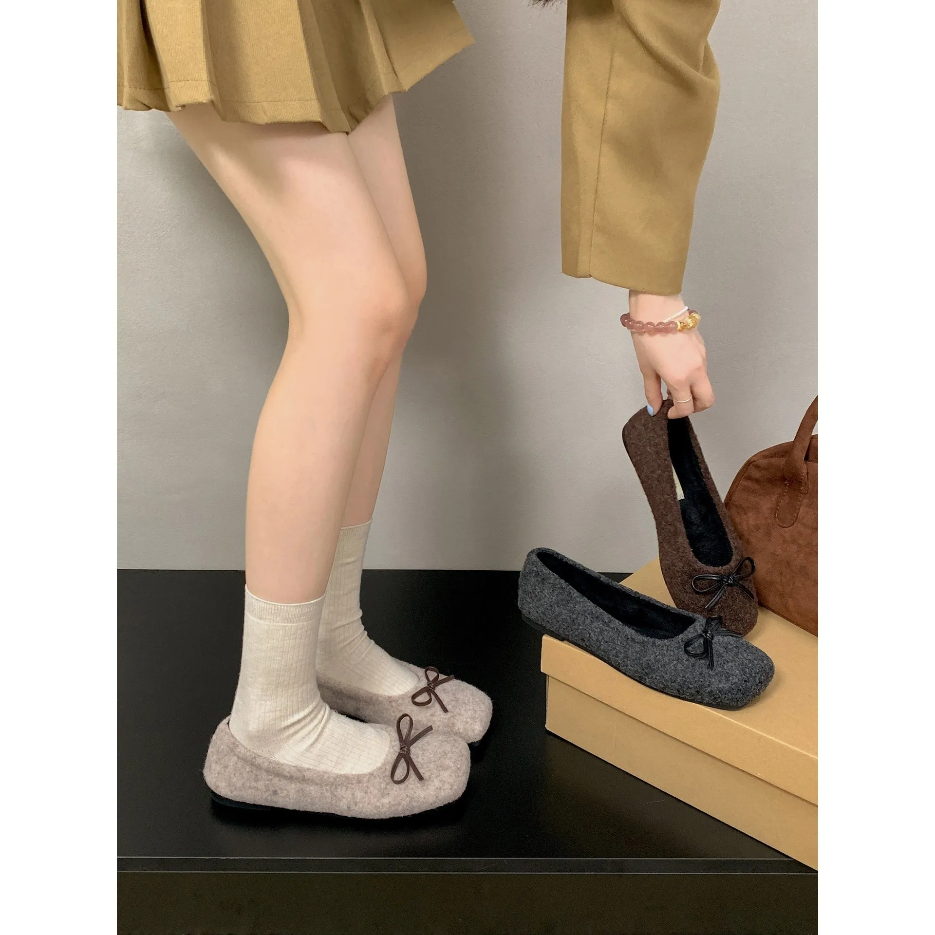 Retro French flat low-cut women's suede pumps in brown with cross shoulder strap detail and round toe
