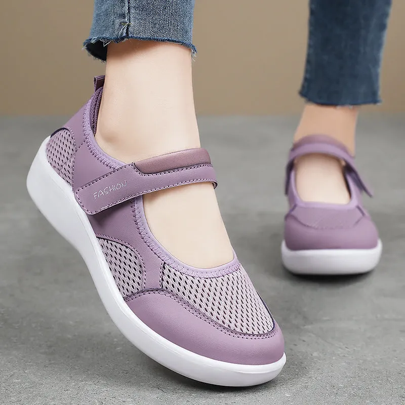 Women's low-top casual shoes in grey with mesh upper and Velcro strap.