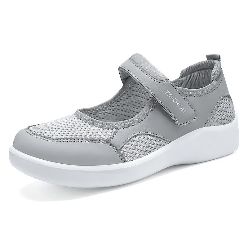 Women's low-top casual shoes in grey with mesh upper and Velcro strap.