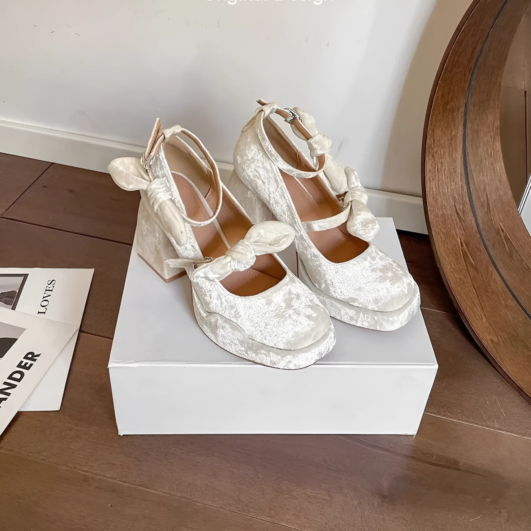 Apricot chunky heel waterproof platform pumps with bow detail, square toe, and buckle fastening on a plain background
