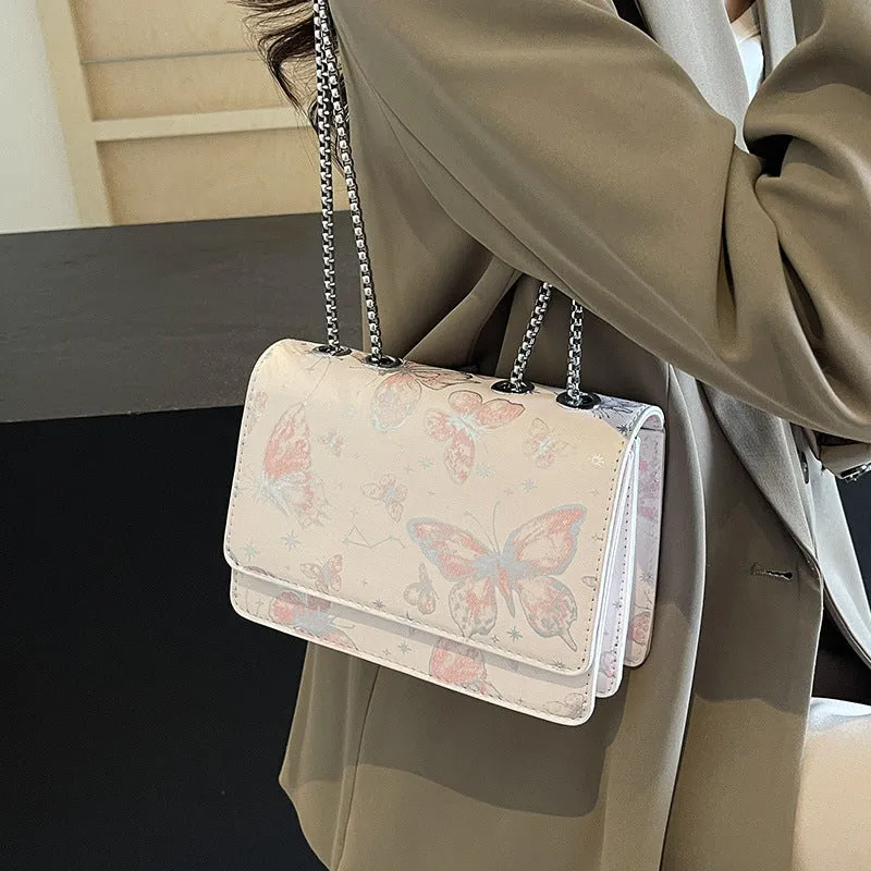 Corduroy chain crossbody bag for women in black, available in large and small sizes, with silver chain strap.