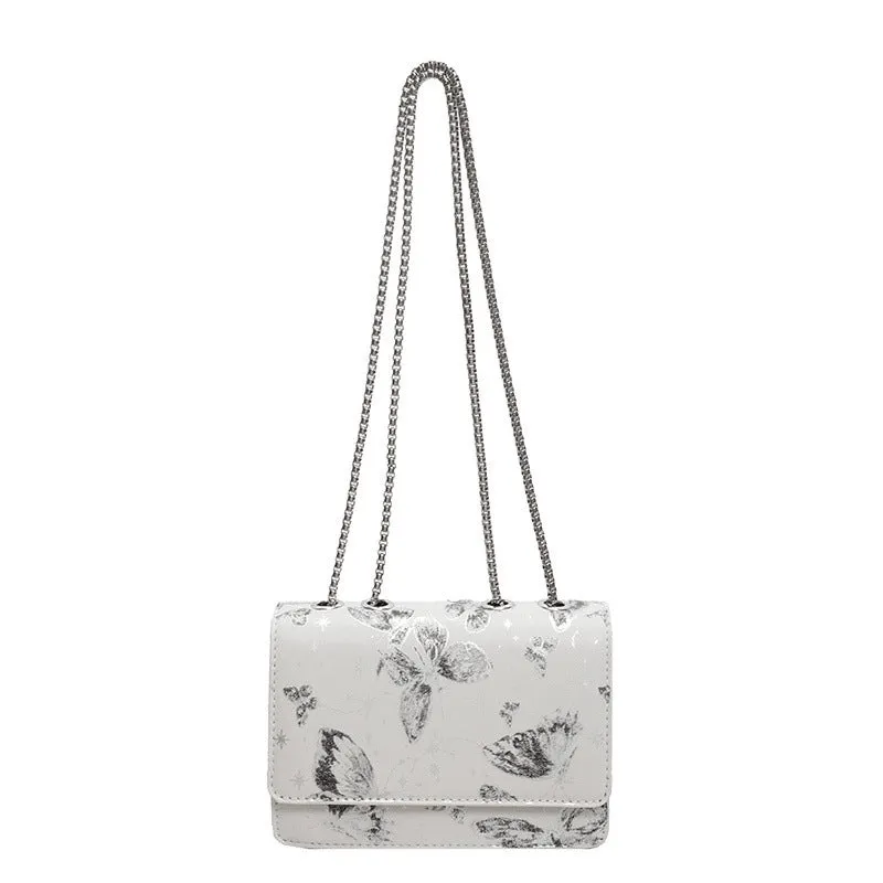 Corduroy chain crossbody bag for women in black, available in large and small sizes, with silver chain strap.