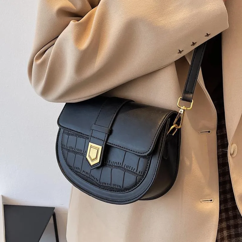 French one shoulder saddle bag in medium-soft PU with lock and stone pattern, available in black, brown, beige, and coffee