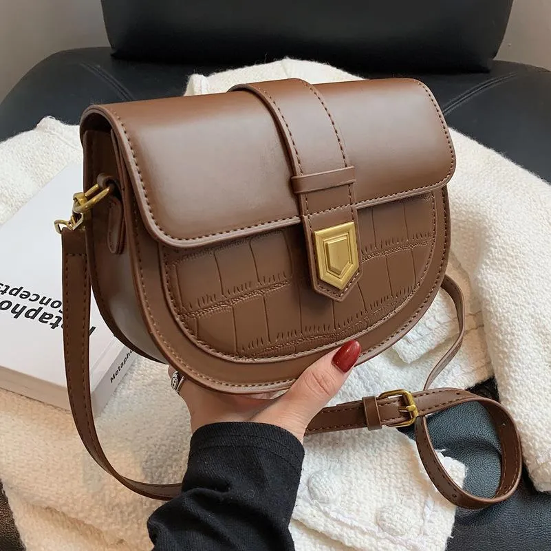 French one shoulder saddle bag in medium-soft PU with lock and stone pattern, available in black, brown, beige, and coffee
