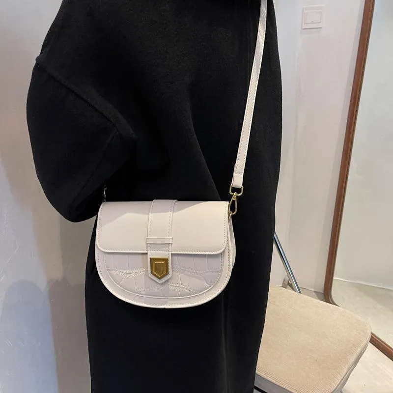 French one shoulder saddle bag in medium-soft PU with lock and stone pattern, available in black, brown, beige, and coffee