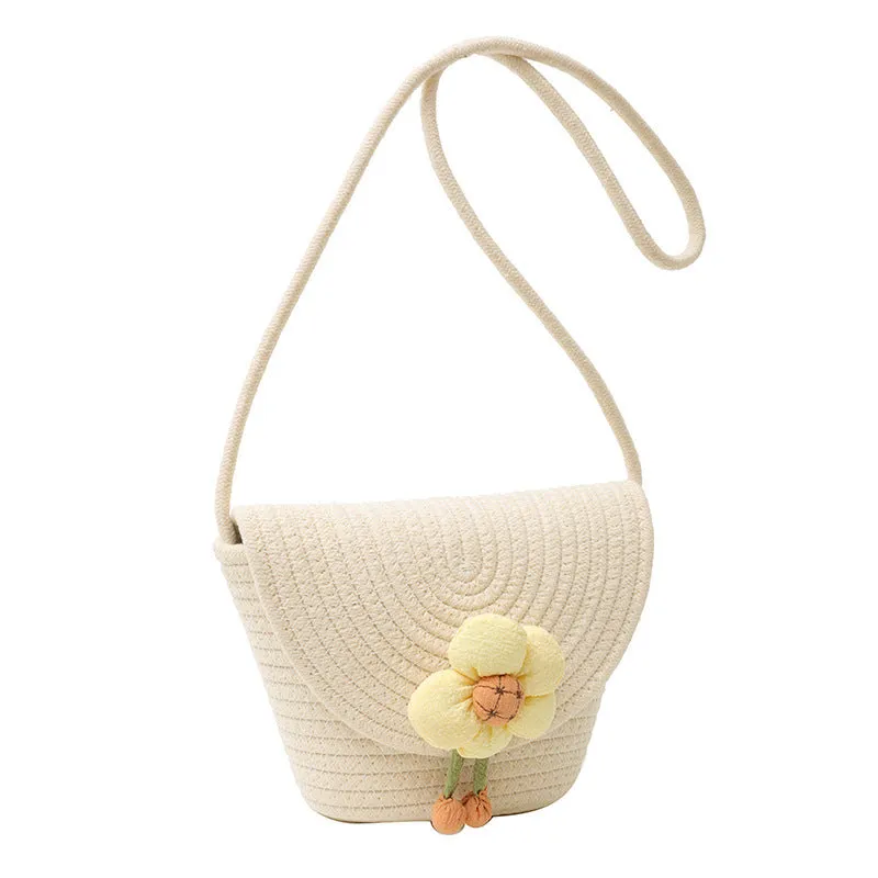 Cotton and linen bucket bag with woven flower details, clamshell shape, available in five colours including sky blue