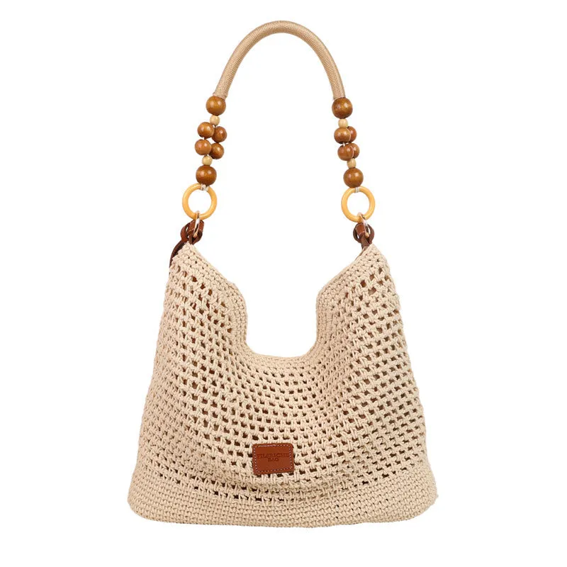 Knitted bucket tote beach bag in black or brown with contrast stitching and crossbody strap