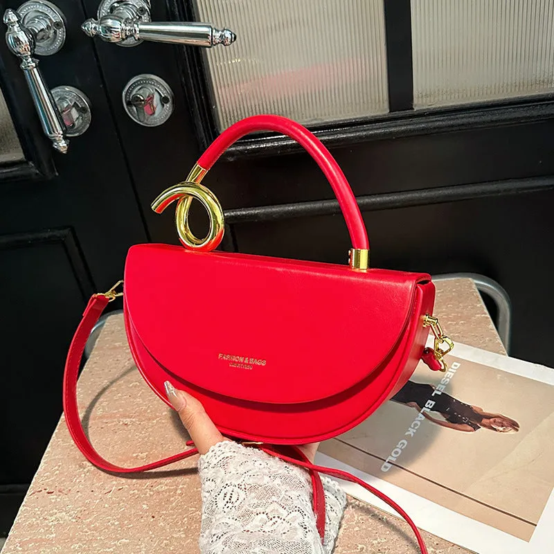 Medium hard PU box saddle bag in solid colour with internal zipper pocket and oval shape