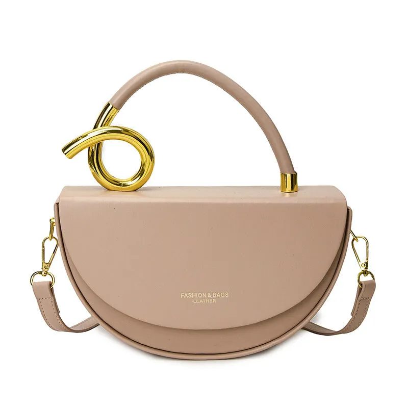 Medium hard PU box saddle bag in solid colour with internal zipper pocket and oval shape