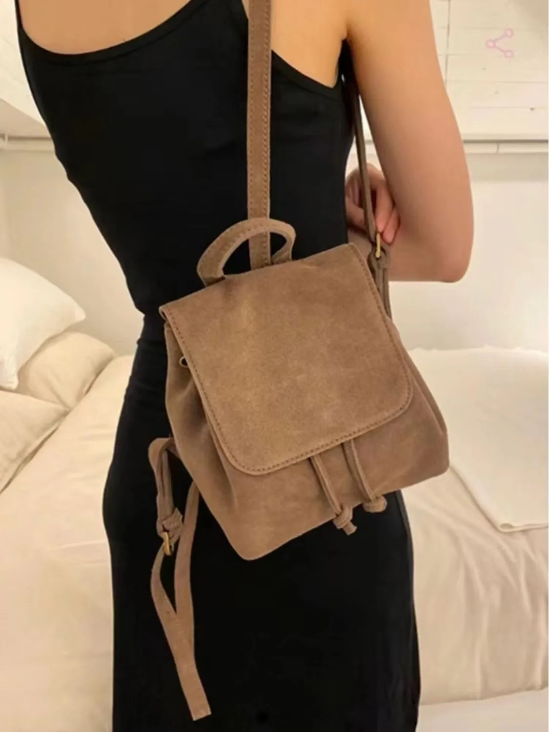 Retro suede girls backpack in brown with shoulder strap and sewing thread detailing