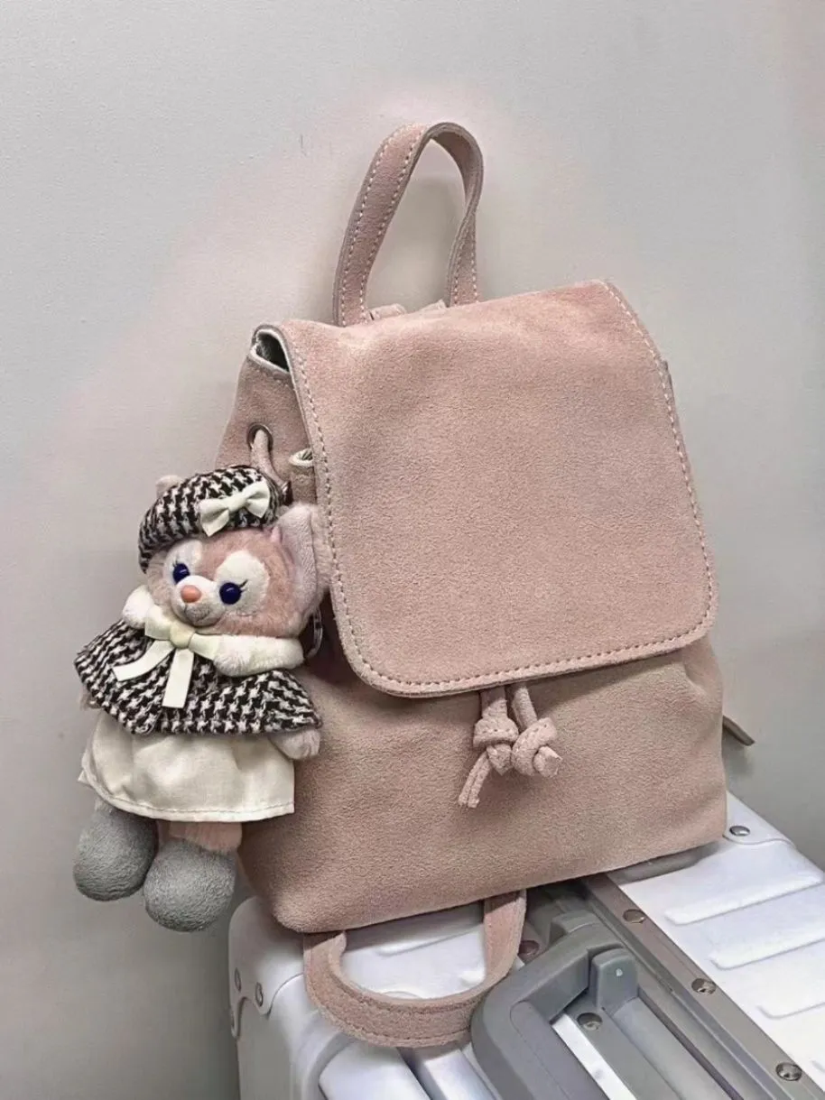 Retro suede girls backpack in brown with shoulder strap and sewing thread detailing