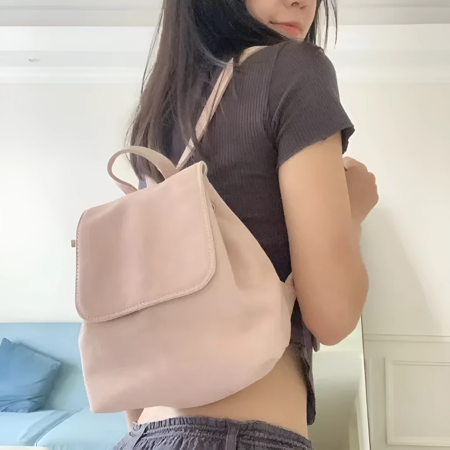 Retro suede girls backpack in brown with shoulder strap and sewing thread detailing