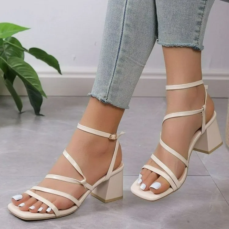 Plus size beige open toe slippers with an adjustable ankle buckle and square toe on a rubber sole.