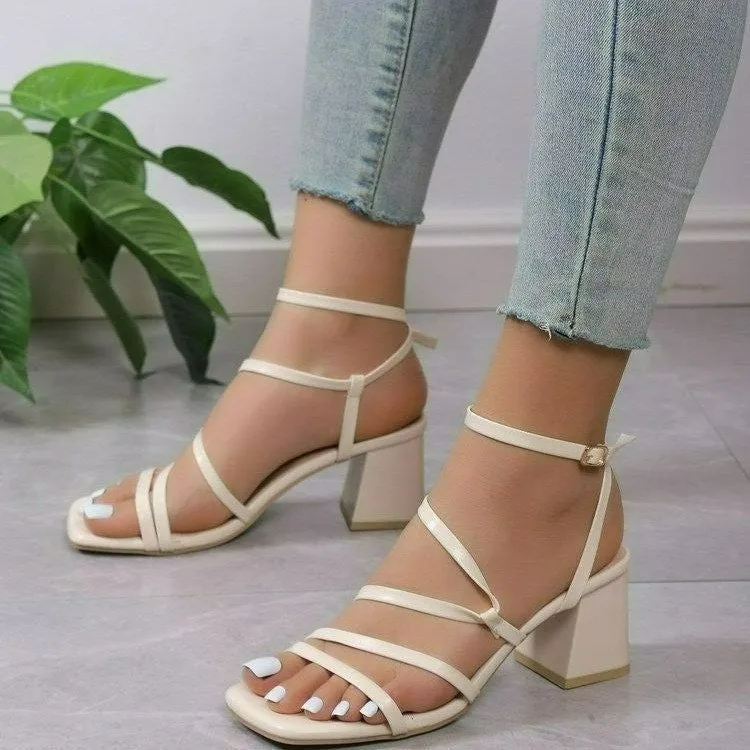 Plus size beige open toe slippers with an adjustable ankle buckle and square toe on a rubber sole.