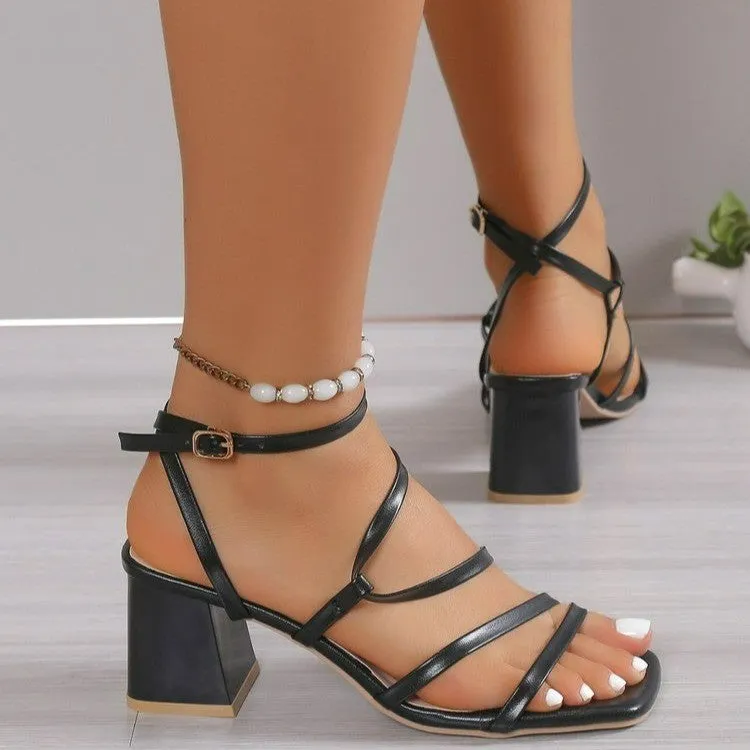 Plus size beige open toe slippers with an adjustable ankle buckle and square toe on a rubber sole.