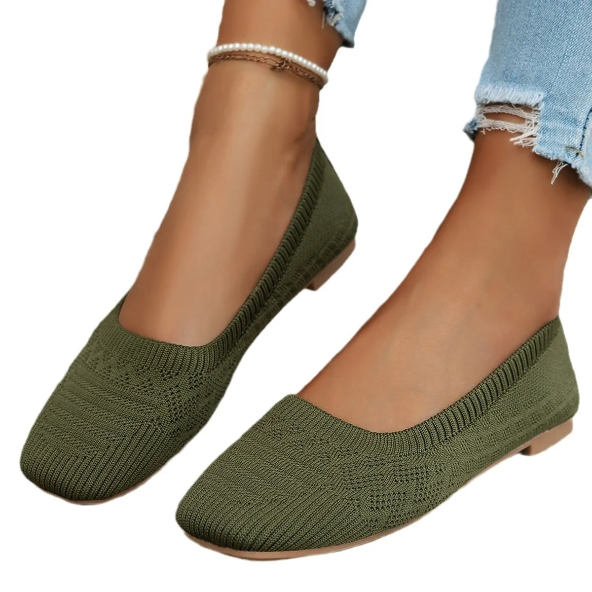Women's knitted canvas slip-on shoes in black with flat heel and shallow mouth