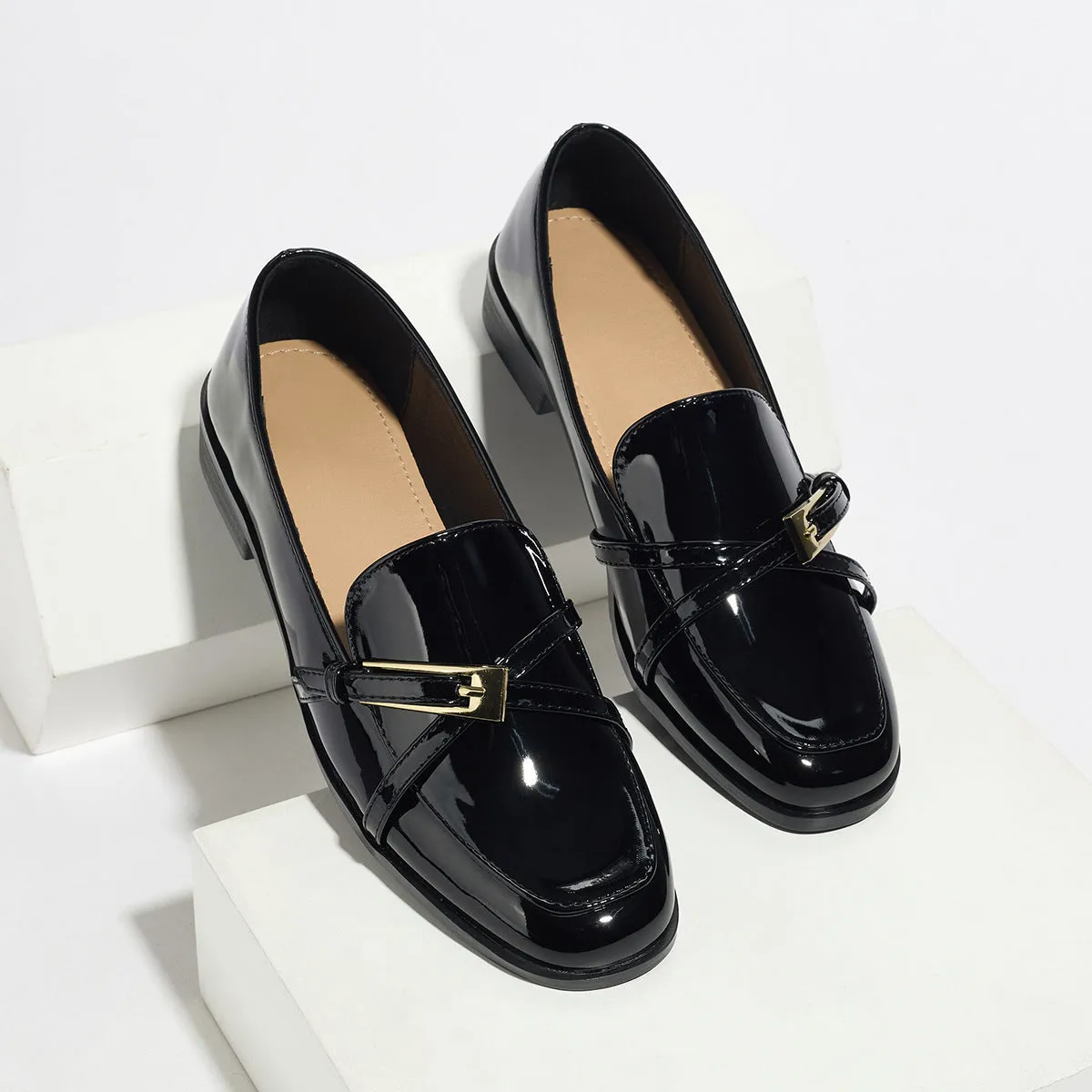 Patent leather square toe loafers in black with low heel and rubber sole