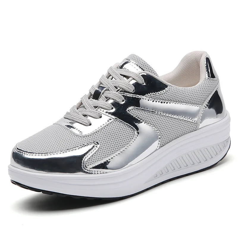 Women's gold platform trainers with mesh upper, cross-strap design and waterproof platform