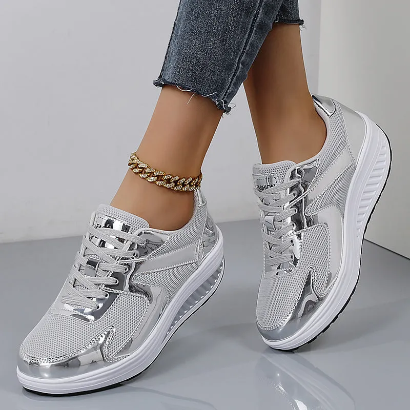 Women's gold platform trainers with mesh upper, cross-strap design and waterproof platform