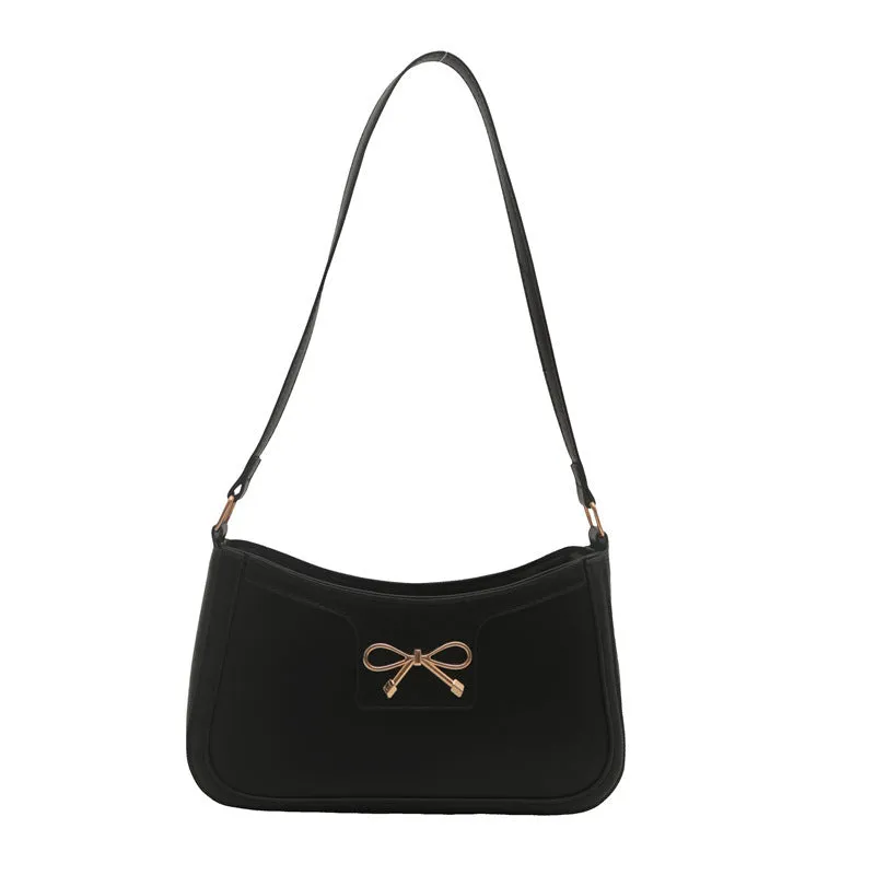 Western style PU leather shoulder bag in horizontal square shape with bow decoration, shown in rose pink colour.
