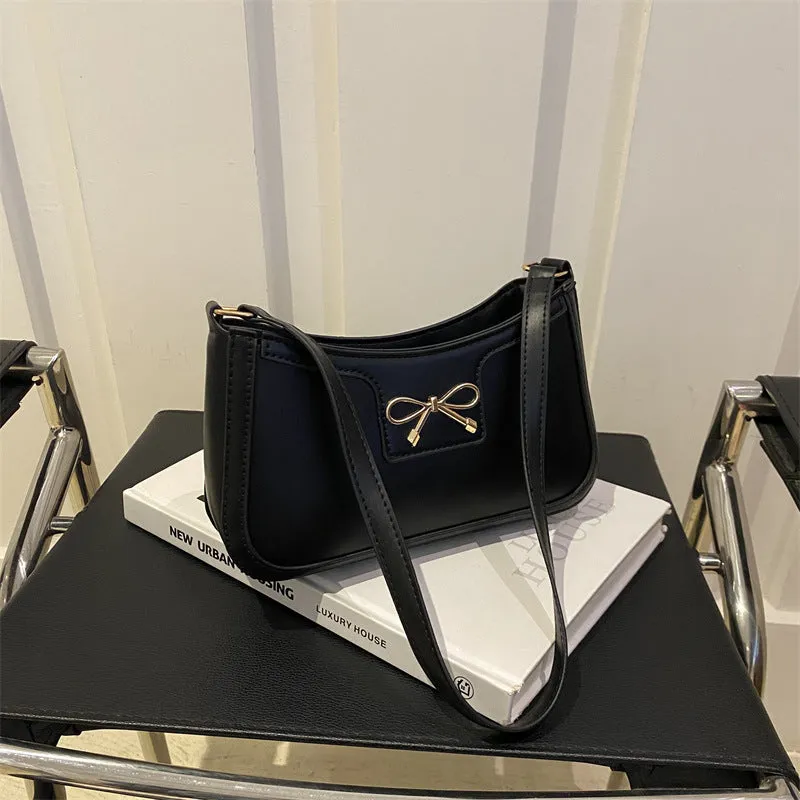 Western style PU leather shoulder bag in horizontal square shape with bow decoration, shown in rose pink colour.