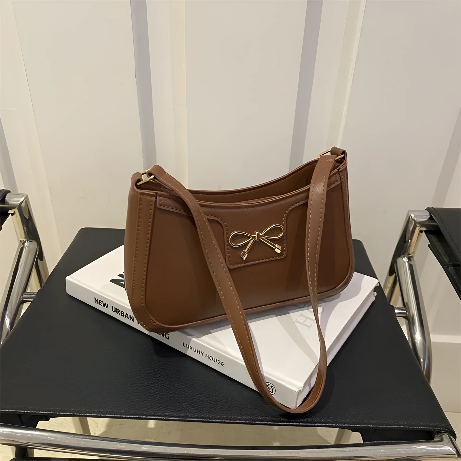 Western style PU leather shoulder bag in horizontal square shape with bow decoration, shown in rose pink colour.