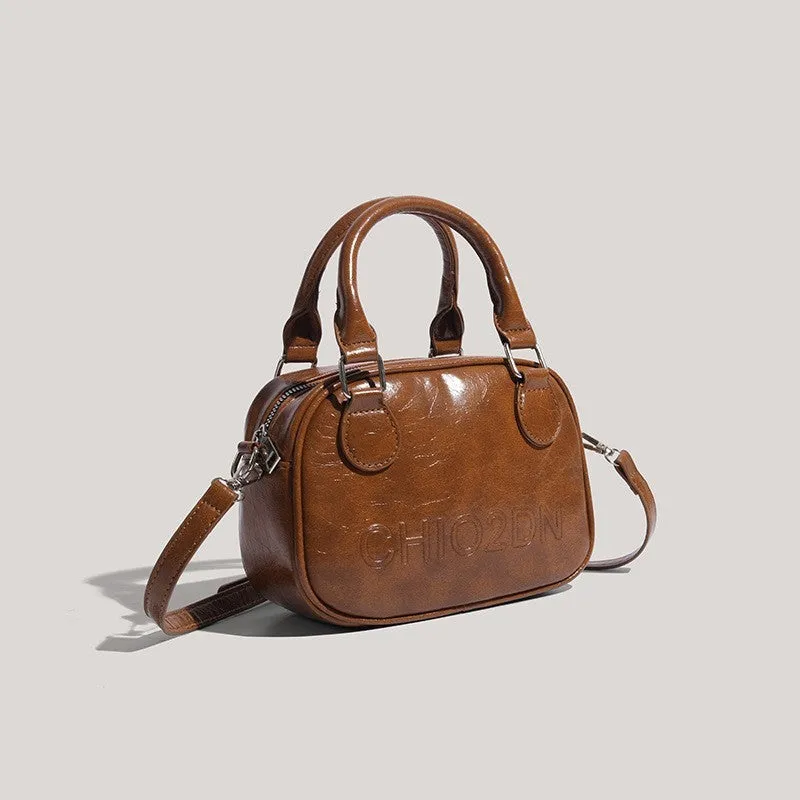 Retro PU crossbody bag with letter and stitching details in horizontal square shape, black colour