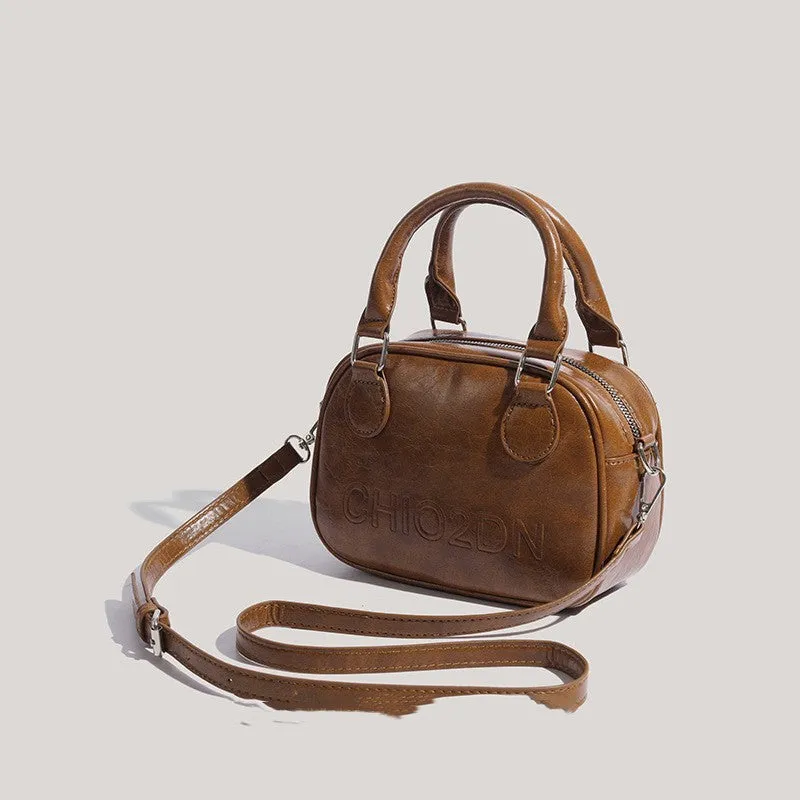 Retro PU crossbody bag with letter and stitching details in horizontal square shape, black colour