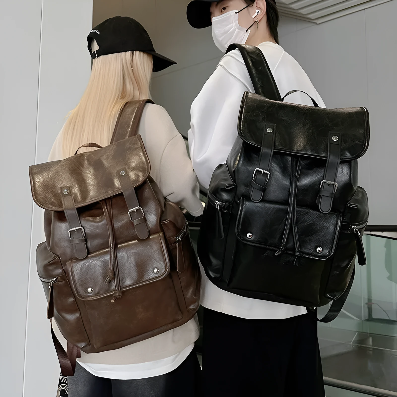 Solid colour PU couple travel backpack in black, curved shoulder strap, waterproof design for leisure travel