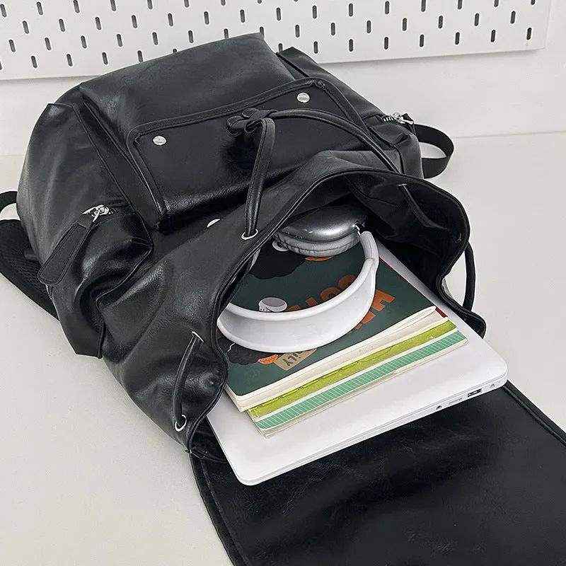 Solid colour PU couple travel backpack in black, curved shoulder strap, waterproof design for leisure travel