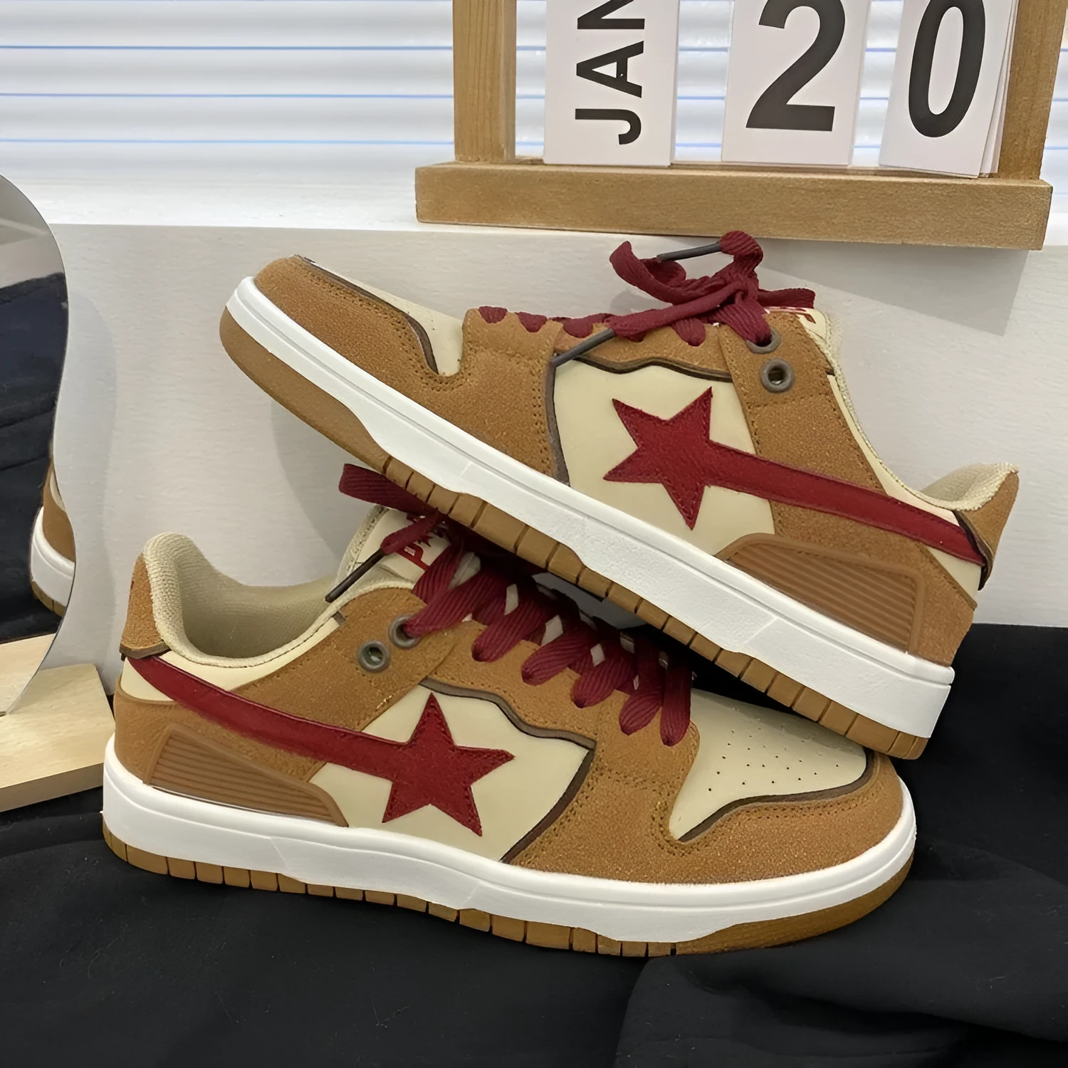 Brown women's platform sneakers with sequin detailing and lace-up front