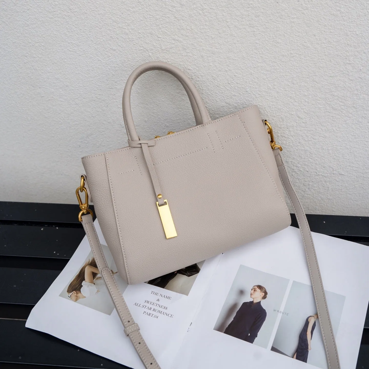 Portable genuine leather women handbag in soft cowhide with horizontal square shape and single strap, available in multiple colours