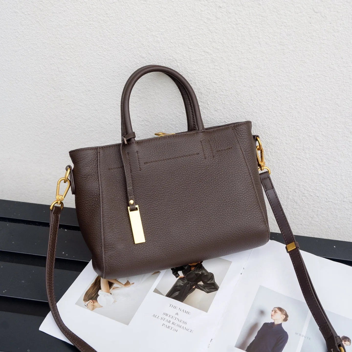 Portable genuine leather women handbag in soft cowhide with horizontal square shape and single strap, available in multiple colours