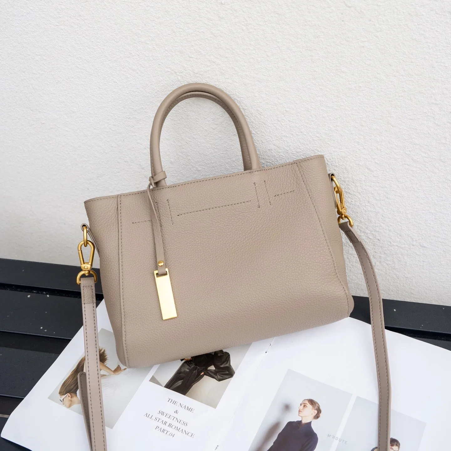 Portable genuine leather women handbag in soft cowhide with horizontal square shape and single strap, available in multiple colours