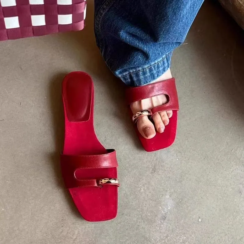 Women's plus size square toe leather slipper with rubber sole in black, red, silver, or white.