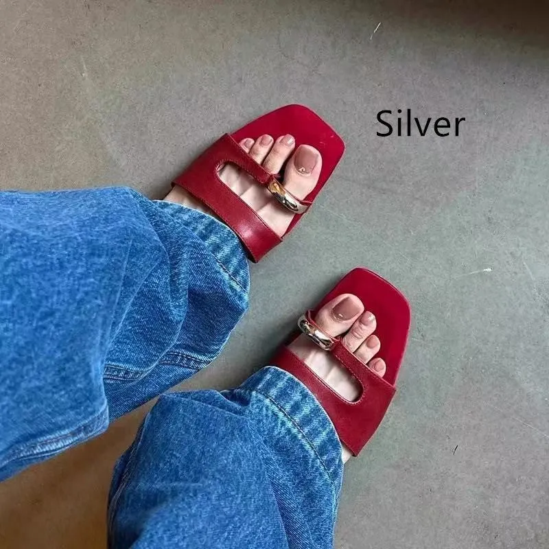 Women's plus size square toe leather slipper with rubber sole in black, red, silver, or white.