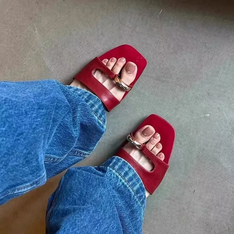 Women's plus size square toe leather slipper with rubber sole in black, red, silver, or white.