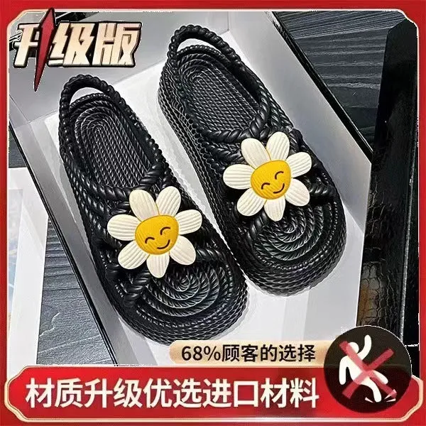 Women's PVC sandals with flower decorations in beige and black colours showing round-toe non-slip design